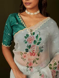 Artistic Organza Silk Off White Saree Featuring Delicate Hand Embroidered Floral Patterns with Dark Green Blouse
