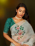 Artistic Organza Silk Off White Saree Featuring Delicate Hand Embroidered Floral Patterns with Dark Green Blouse