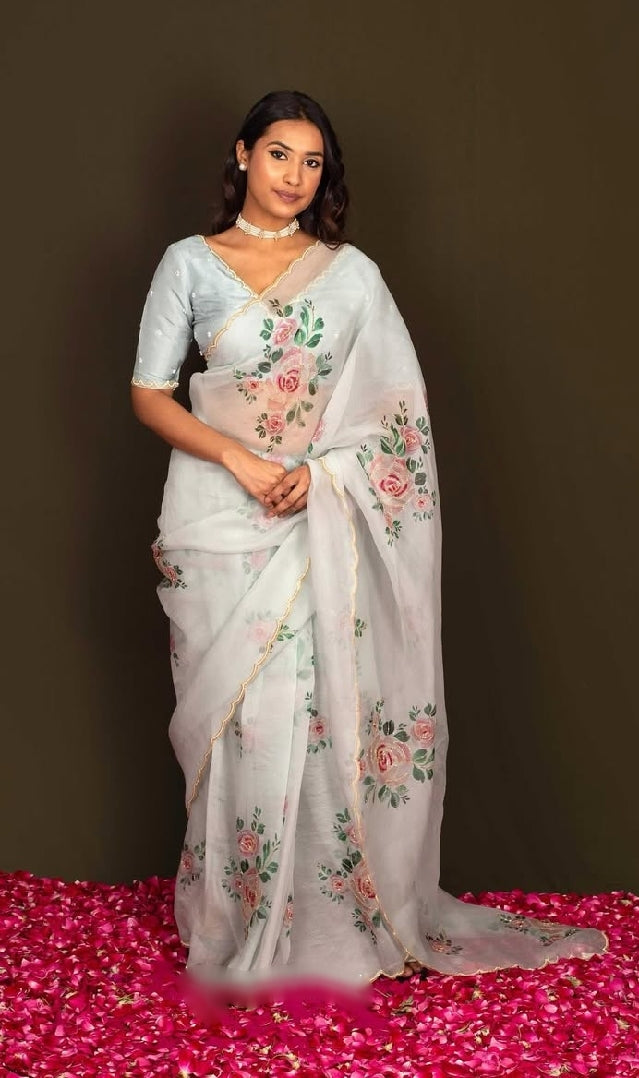 Beautiful Organza Sky Saree With Subtle Floral Print and Embroidered Sky Blouse