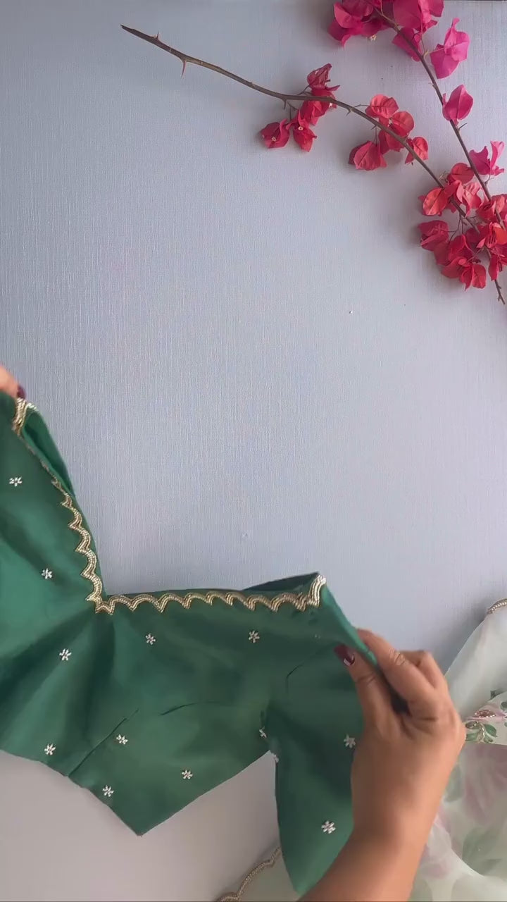 Artistic Organza Silk Off White Saree Featuring Delicate Hand Embroidered Floral Patterns with  Dark Green  Blouse